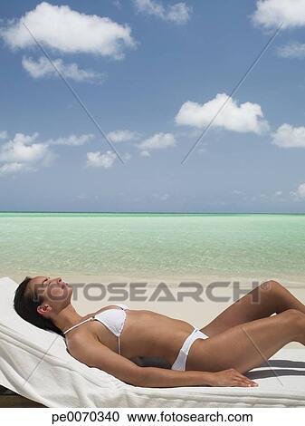 Woman In Sunbathing On Lounge Chair Beach Stock Image Lounge Chair On Beach Stock Image