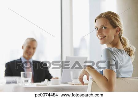 Stock Photo - Business people having working lunch in restaurant. Fotosearch - Search Stock Images, Mural Photographs, Pictures, and Clipart Photos