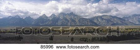 Stock Photograph - Clouds over Grand Teton National Park WY. Fotosearch