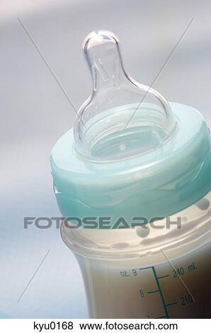 Baby bottle full of milk, close-up View Large Photo Image Stock Photo - Baby bottle full of milk, close-up. Fotosearch