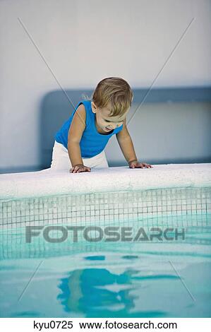 Baby boy looking into a swimming pool View Large Photo Image Stock Photography - Baby boy looking into a swimming pool. Fotosearch