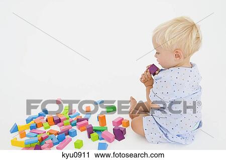 Baby boy playing with blocks View Large Photo Image Stock Image - Baby boy playing with blocks. Fotosearch