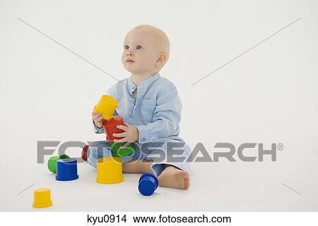 Picture - Baby boy stacking blocks. Fotosearch