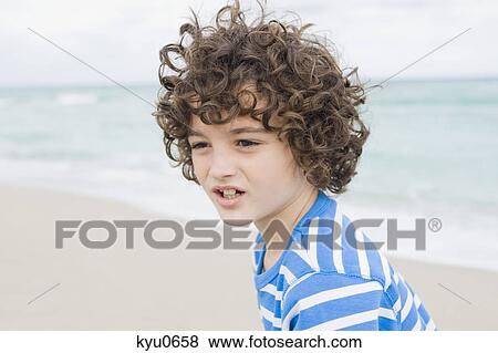 Stock Photo - Boy on the beach. Fotosearch