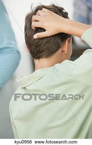 Stock Photograph - Boy scratching his head. Fotosearch