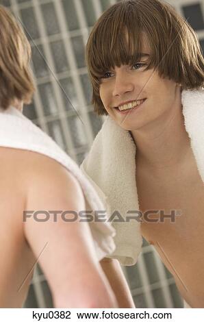 Boy smiling in the bathroom mirror View Large Photo Image Stock Image - Boy smiling in the bathroom mirror. Fotosearch