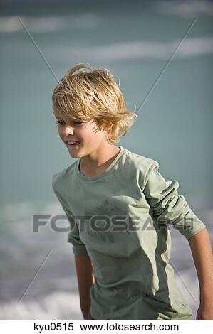 Boy smiling on the beach View Large Photo Image Stock Photography - Boy smiling on the beach. Fotosearch
