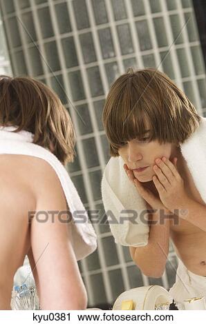 Boy washing his face in the bathroom View Large Photo Image Stock Image - Boy washing his face in the bathroom. Fotosearch