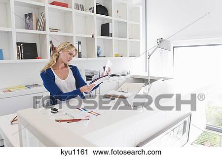 Businesswoman choosing color swatches View Large Photo Image Stock Image - Businesswoman choosing color swatches. Fotosearch