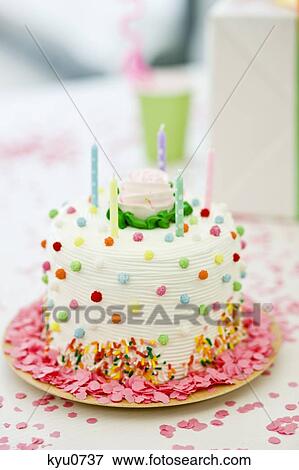 Stock Photo - Close-up of a birthday cake with candles. Fotosearch