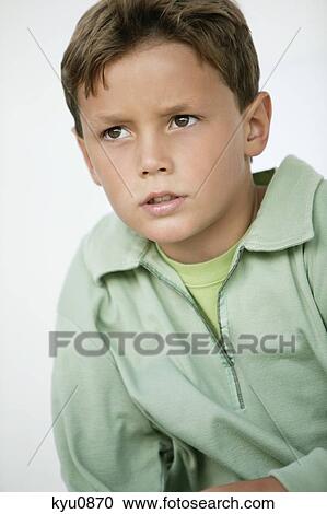 Close-up of a boy thinking View Large Photo Image Stock Image - Close-up of a boy thinking. Fotosearch