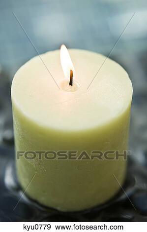 Close-up of a burning candle View Large Photo Image Stock Photo - Close-up of a burning candle. Fotosearch