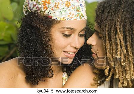 Stock Photography - Close-up of a couple romancing. Fotosearch