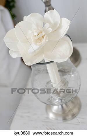 Stock Image - Close-up of a flower pot on a table. Fotosearch
