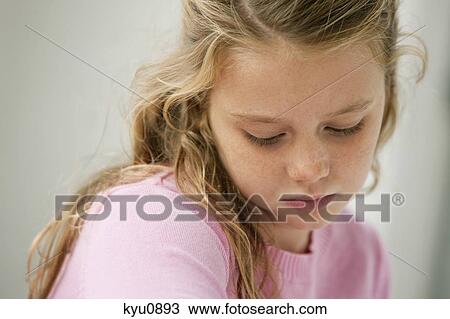 Close-up of a girl thinking View Large Photo Image Stock Image - Close-up of a girl thinking. Fotosearch