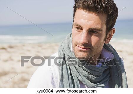 Close-up of a man on the beach View Large Photo Image Picture - Close-up of a man on the beach. Fotosearch