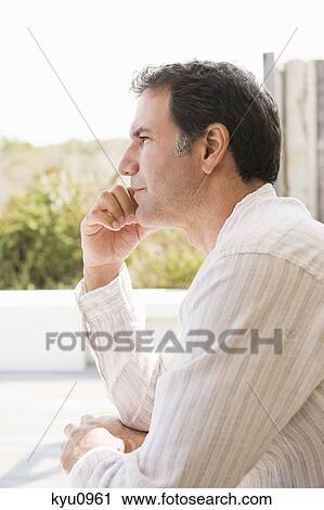 Stock Image - Close-up of a man thinking. Fotosearch