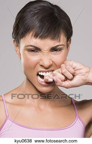 Stock Photo - Close-up of a woman looking frustrated. Fotosearch