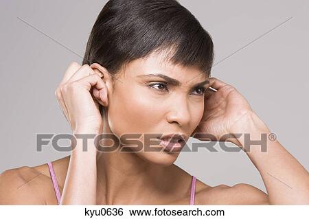 Stock Photograph - Close-up of a woman looking frustrated. Fotosearch