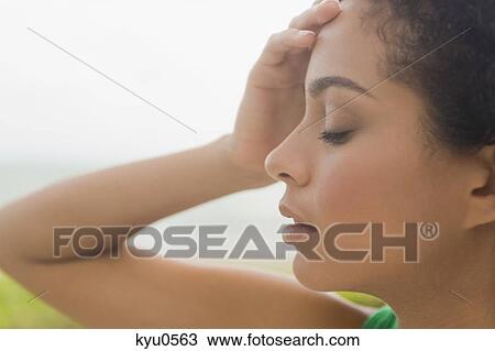 Close-up of a woman looking worried View Large Photo Image Stock Image - Close-up of a woman looking worried. Fotosearch