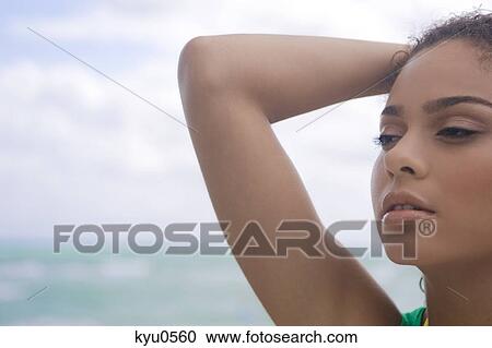 Close-up of a woman on the beach View Large Photo Image Stock Image - Close-up of a woman on the beach. Fotosearch