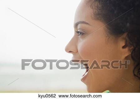 Close-up of a woman shouting on the beach View Large Photo Image Stock Image - Close-up of a woman shouting on the beach. Fotosearch