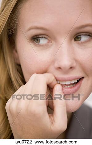 Stock Image - Close-up of a woman smiling. Fotosearch