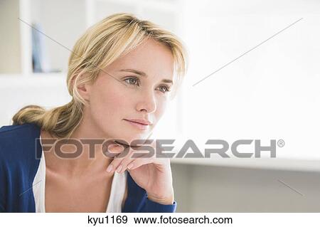Stock Photo - Close-up of a woman thinking. Fotosearch