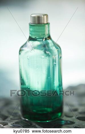 Stock Photography - Close-up of an empty bottle of aromatherapy oil. Fotosearch