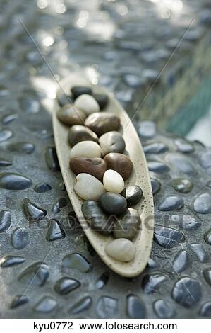 Close-up of pebbles in a tray View Large Photo Image Stock Image - Close-up of pebbles in a tray. Fotosearch