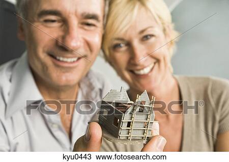Couple looking at a model home View Large Photo Image Stock Image - Couple looking at a model home. Fotosearch