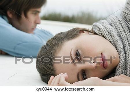 Couple lying on the floor View Large Photo Image Picture - Couple lying on the floor. Fotosearch