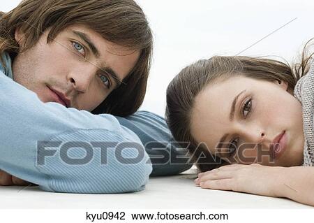 Couple lying on the floor View Large Photo Image Stock Image - Couple lying on the floor. Fotosearch