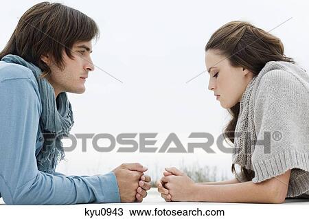 Stock Image - Couple lying on the floor. Fotosearch