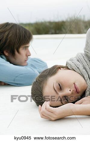 Couple lying on the floor View Large Photo Image Stock Photography - Couple lying on the floor. Fotosearch