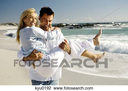 Couple on the beach View Large Photo Image Stock Image - Couple on the beach. Fotosearch