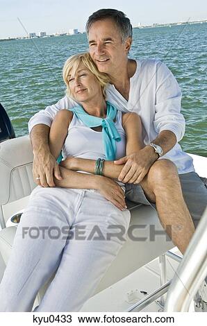 Couple romancing in a tourboat View Large Photo Image Stock Image - Couple romancing in a tourboat. Fotosearch