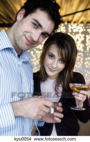 Picture - Couple smiling at the camera. Fotosearch