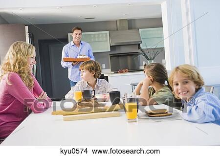 Family at the breakfast table View Large Photo Image Picture - Family at the breakfast table. Fotosearch