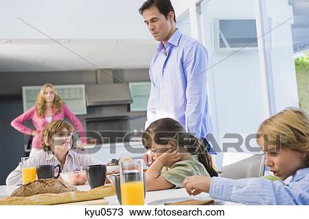Stock Image - Family at the breakfast table. Fotosearch