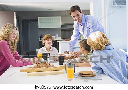 Stock Photography - Family at the breakfast table. Fotosearch