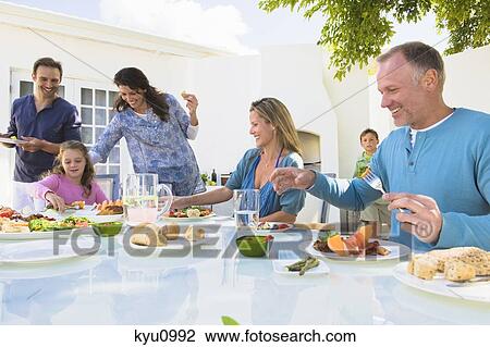 Family having breakfast at the dining table View Large Photo Image Stock Image - Family having breakfast at the dining table. Fotosearch