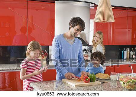 Stock Image - Family in the kitchen. Fotosearch