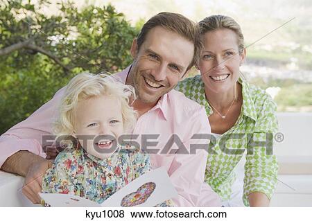 Family smiling on a terrace View Large Photo Image Stock Photo - Family smiling on a terrace. Fotosearch