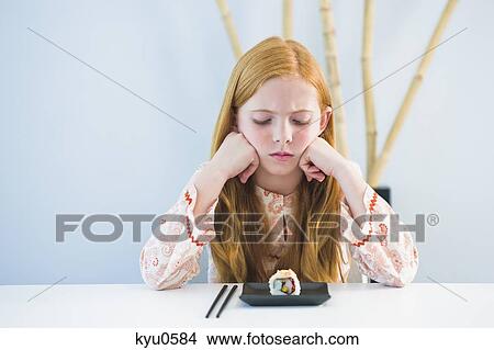 Picture - Girl at the dining table. Fotosearch
