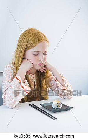 Girl at the dining table View Large Photo Image Stock Photography - Girl at the dining table. Fotosearch