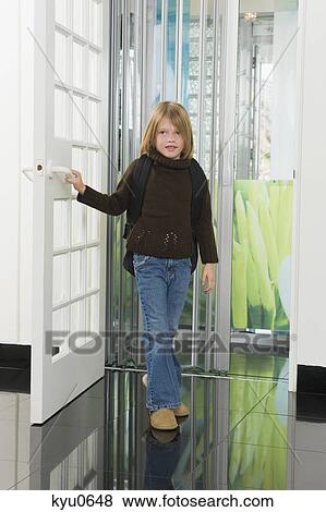 Stock Photo - Girl entering a house. Fotosearch