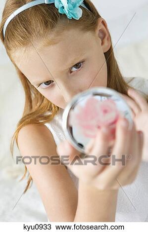 Girl holding a hand mirror View Large Photo Image Stock Image - Girl holding a hand mirror. Fotosearch