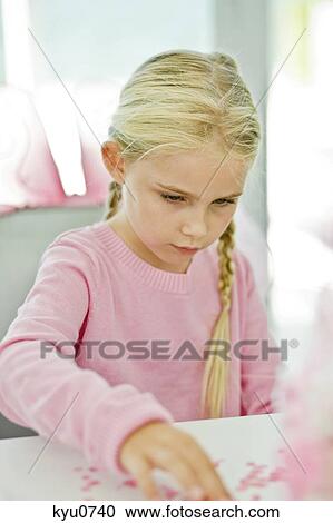 Girl sitting on a chair View Large Photo Image Stock Image - Girl sitting on a chair. Fotosearch