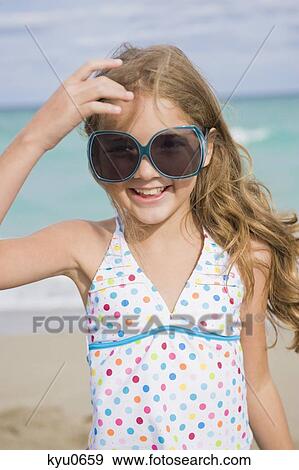Girl smiling on the beach View Large Photo Image Stock Photo - Girl smiling on the beach. Fotosearch